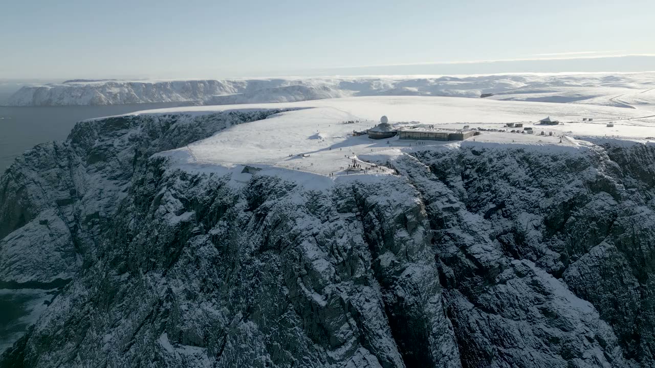 The snow-covered North Cape cliff and its plateau above the Arctic Ocean