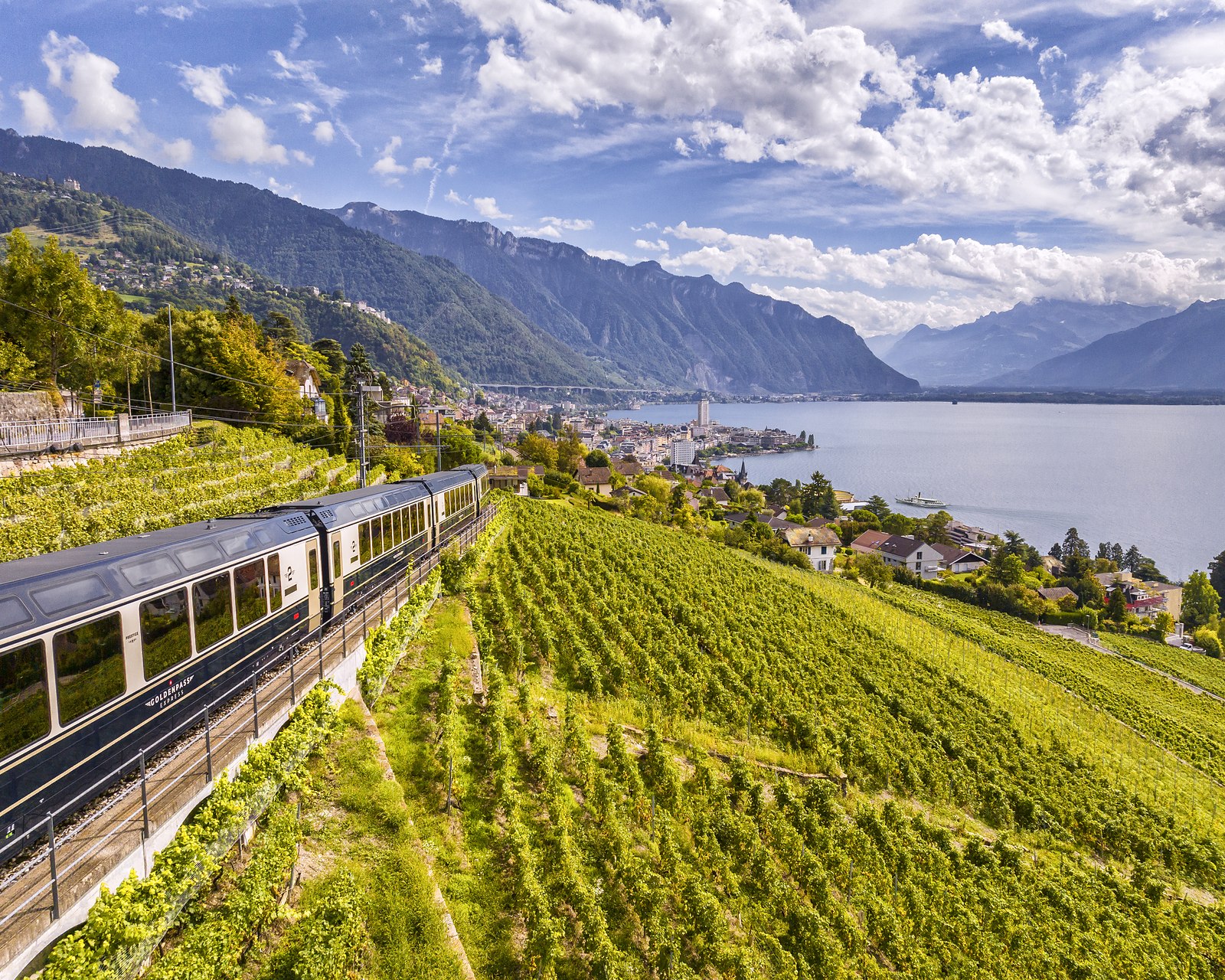 The GoldenPass Express running through the vineyards above Montreux and Lake Geneva