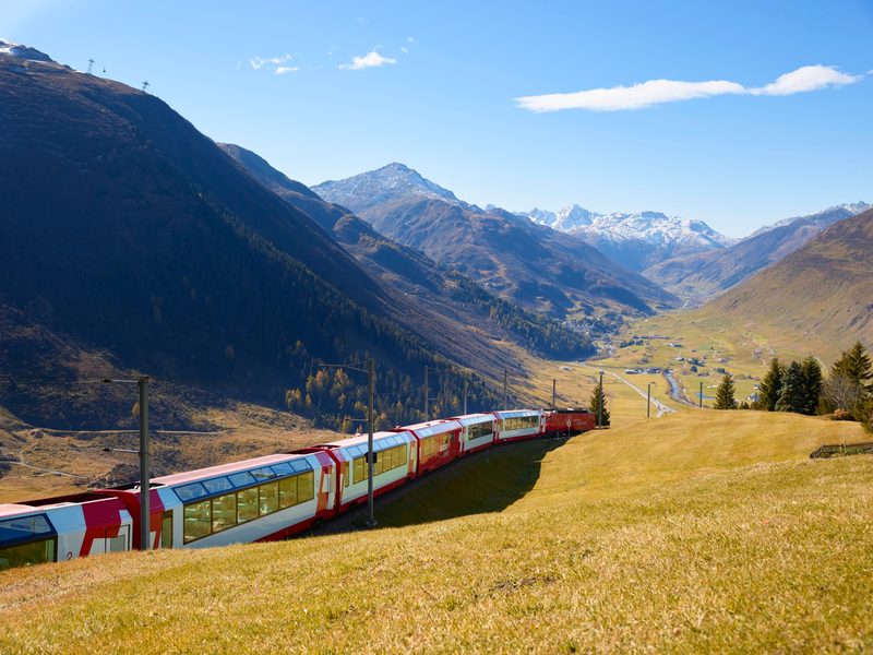 A panoramic train crossing the snow-covered Swiss Alps