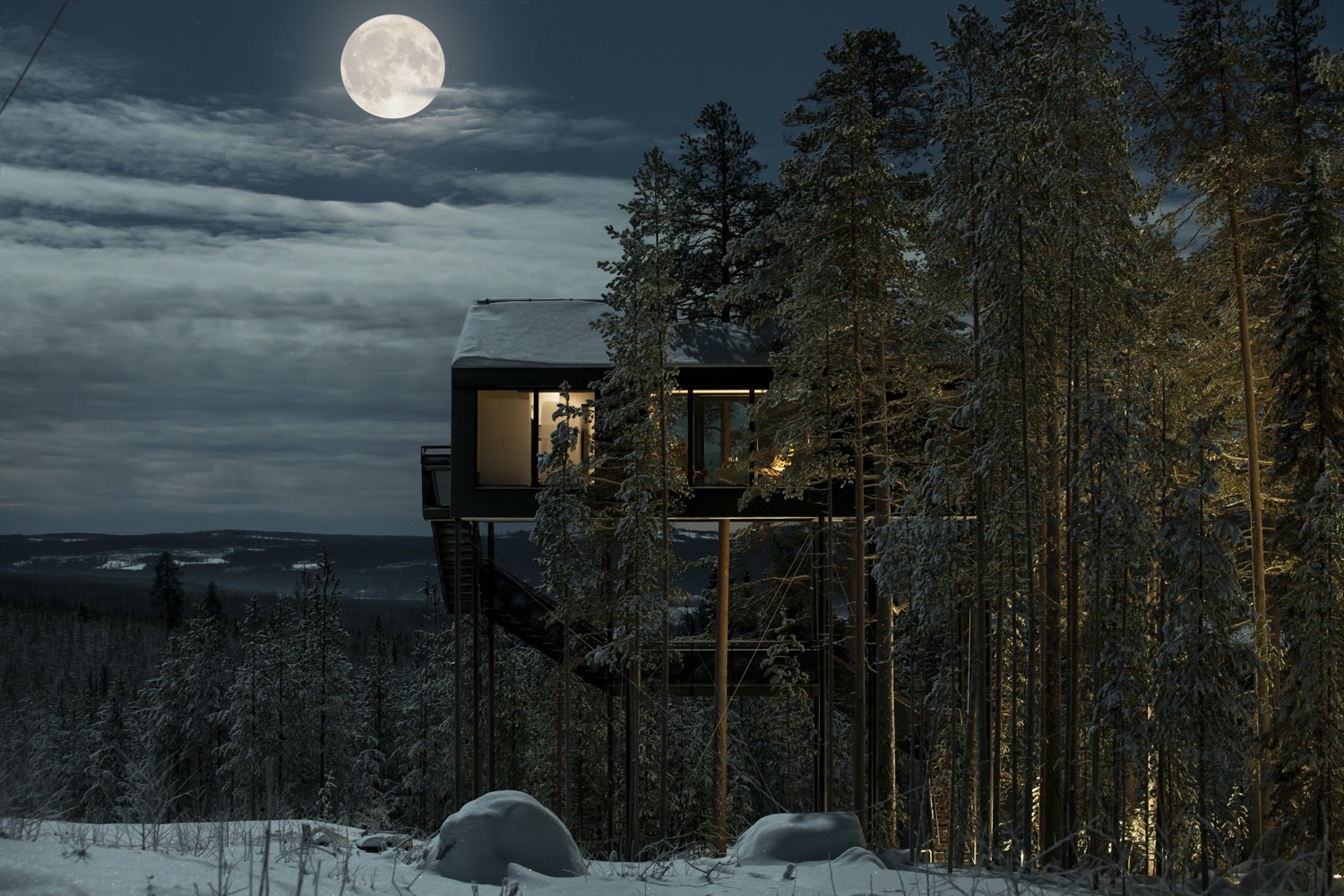 The 7th Room at Treehotel, lit under a full moon above the forest at Harads